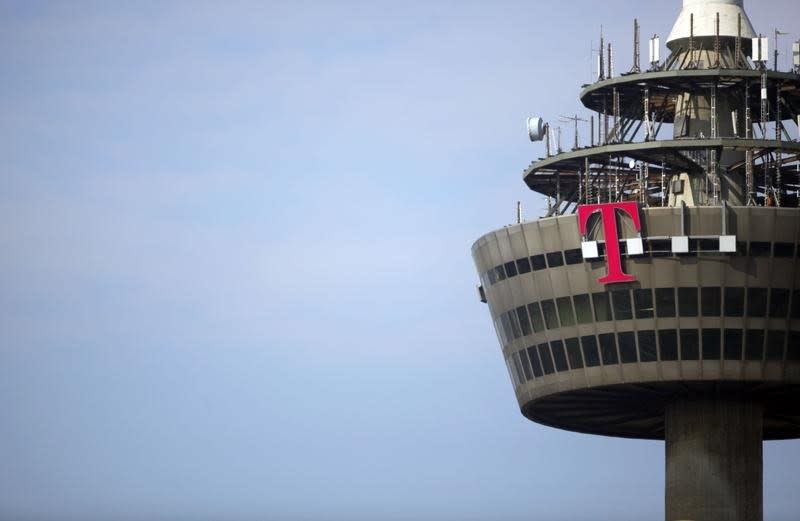The logo of Deutsche Telekom is pictured on the 266 metre high "Colonia" TV tower in the western German city of Cologne March 25, 2013. REUTERS/Wolfgang Rattay