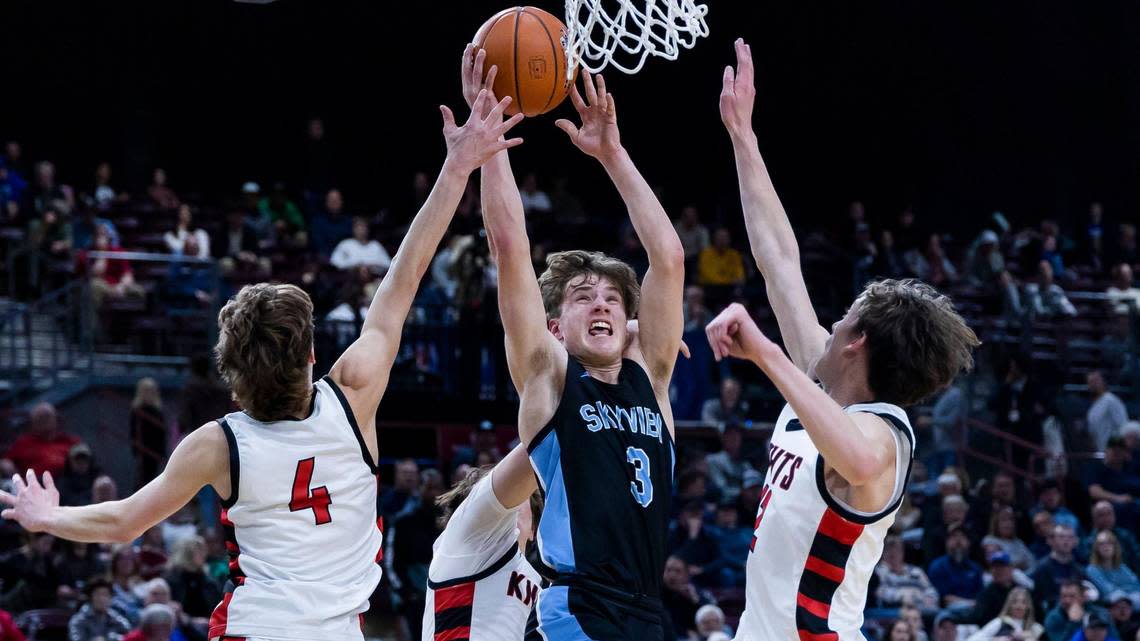 Skyview senior Jonah Wockenfuss drives and draws a foul on Hillcrest’s Ike Sutton in the 4A boys basketball state semifinals on March 3.