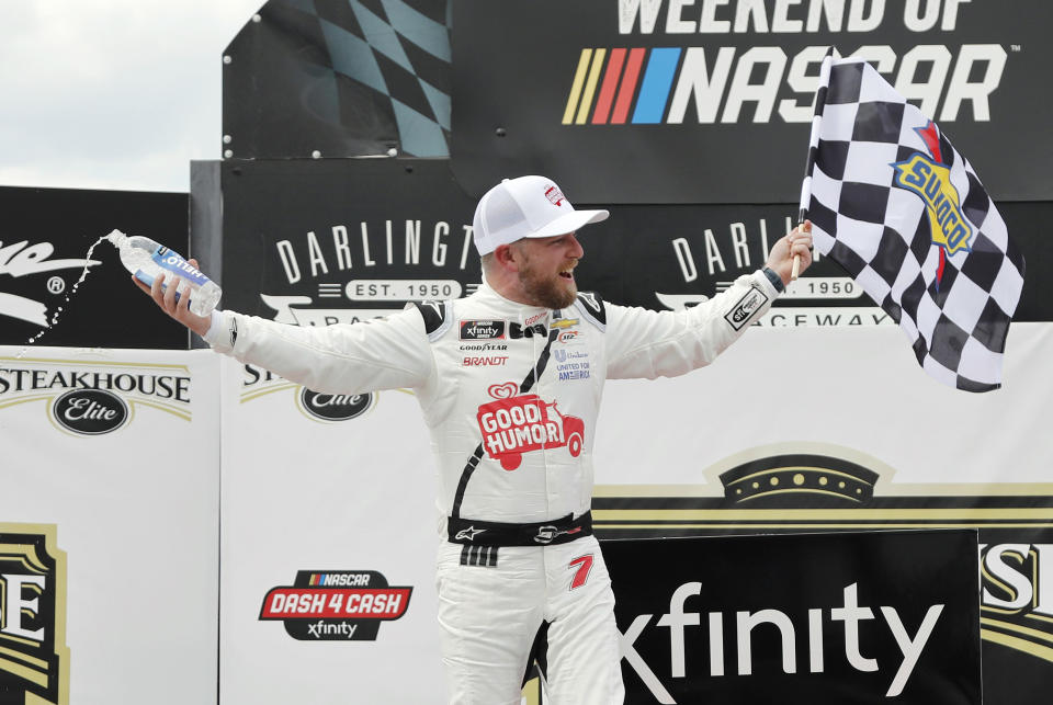 Justin Allgaier celebrates in Victory Lane after winning the NASCAR Xfinity Series auto race at Darlington Raceway, Saturday, May 8, 2021, in Darlington, S.C. (AP Photo/Terry Renna)