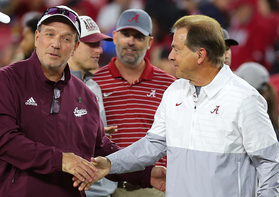 TUSCALOOSA, ALABAMA - OCTOBER 08: Head coach Jimbo Fisher of the Texas A&M Aggies and head coach Nick Saban of the Alabama Crimson Tide shake hands during pregame warmups at Bryant-Denny Stadium on October 08, 2022 in Tuscaloosa, Alabama. (Photo by Kevin C. Cox/Getty Images)
