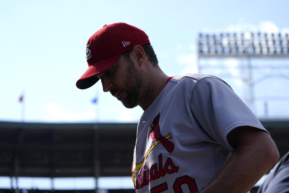 St. Louis Cardinals starting pitcher Adam Wainwright enters the dugout after pitching in the fifth inning of a baseball game against the Chicago Cubs Tuesday, Aug. 23, 2022, in Chicago. (AP Photo/Charles Rex Arbogast)