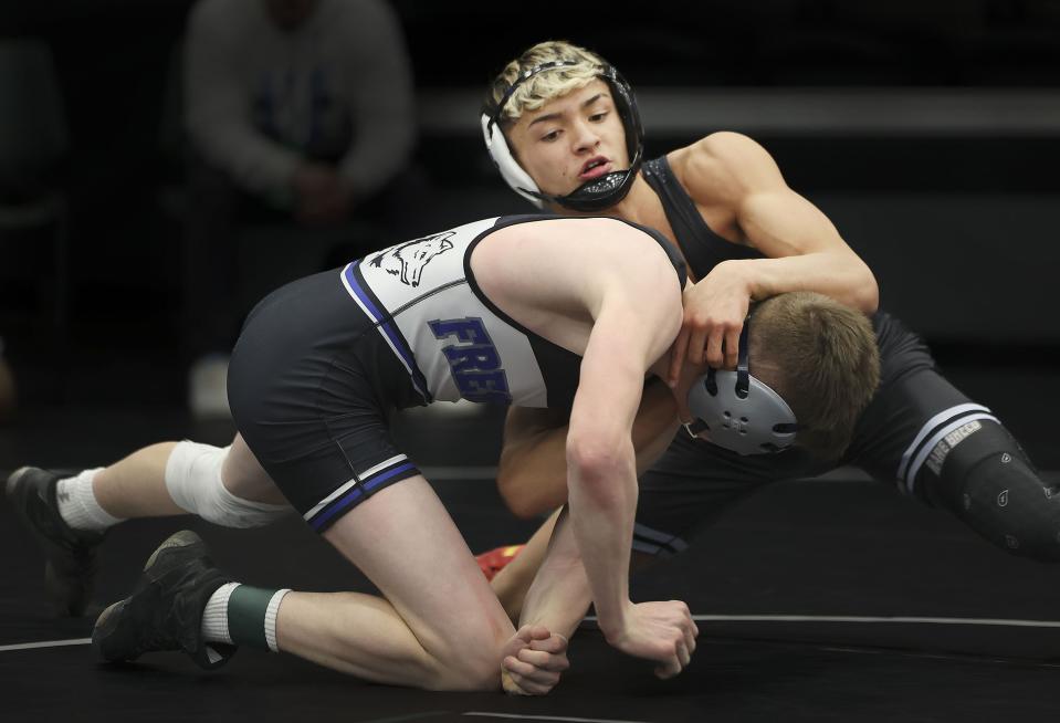 Westlake’s Israel Borge, right, wrestles Fremont’s Colby Tennant in the 6A Wrestling State Championships at the UCCU Center in Orem on Friday, Feb. 16, 2024. | Laura Seitz, Deseret News