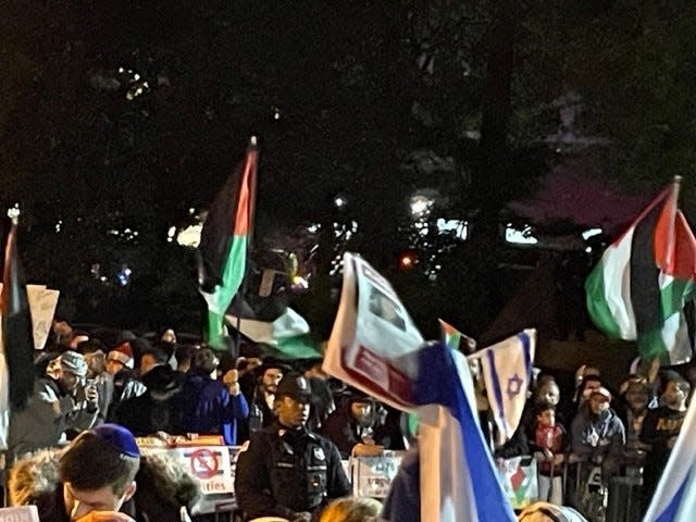 Protesters waved Israeli and Palestinian flags outside Teaneck's municipal building on Tuesday, Oct. 17, as the council debated a resolution on the Hamas terror attacks in Israel.