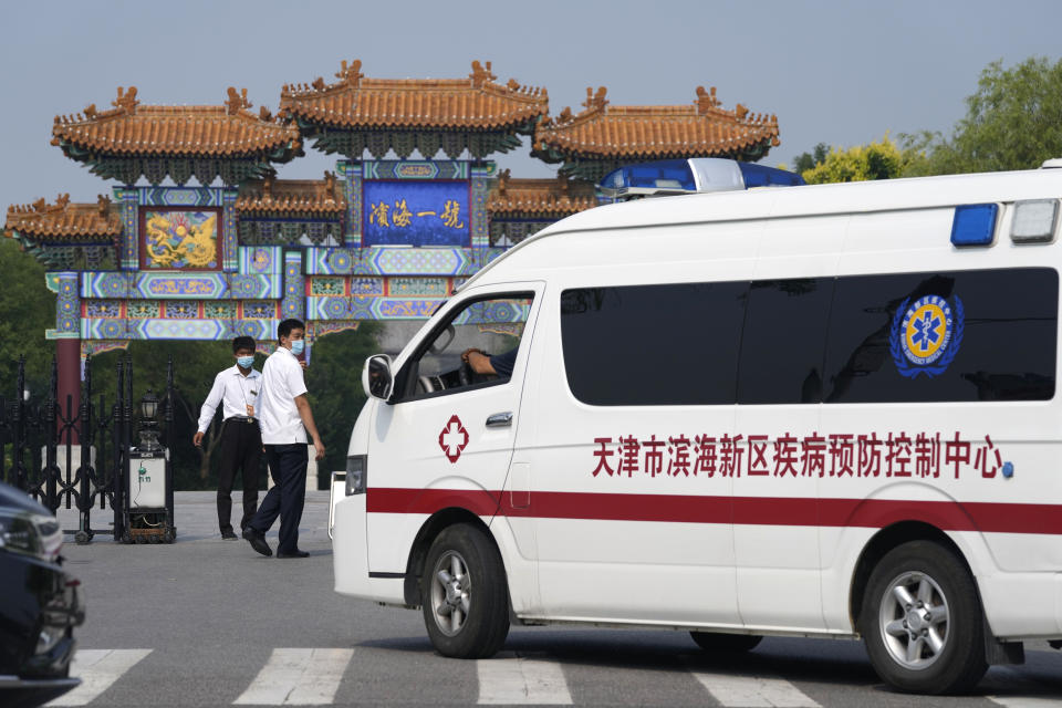 Security guards watch as a vehicle for the epidemic control center pulls up to the entrance into the Tianjin Binhai No. 1 Hotel where U.S. and Chinese officials are expected to hold talks in Tianjin municipality in China Monday, July 26, 2021. America's No. 2 diplomat has arrived in China to discuss the fraught relationship between the two countries on Monday with two top Foreign Ministry officials. (AP Photo/Ng Han Guan)