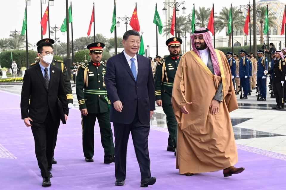 Chinese President Xi Jinping, paying a state visit to Saudi Arabia, attends a welcoming ceremony with Saudi Crown Prince Mohammed bin Salman at the royal palace in Riyadh, Saudi Arabia on 8 December 2022 (AP)