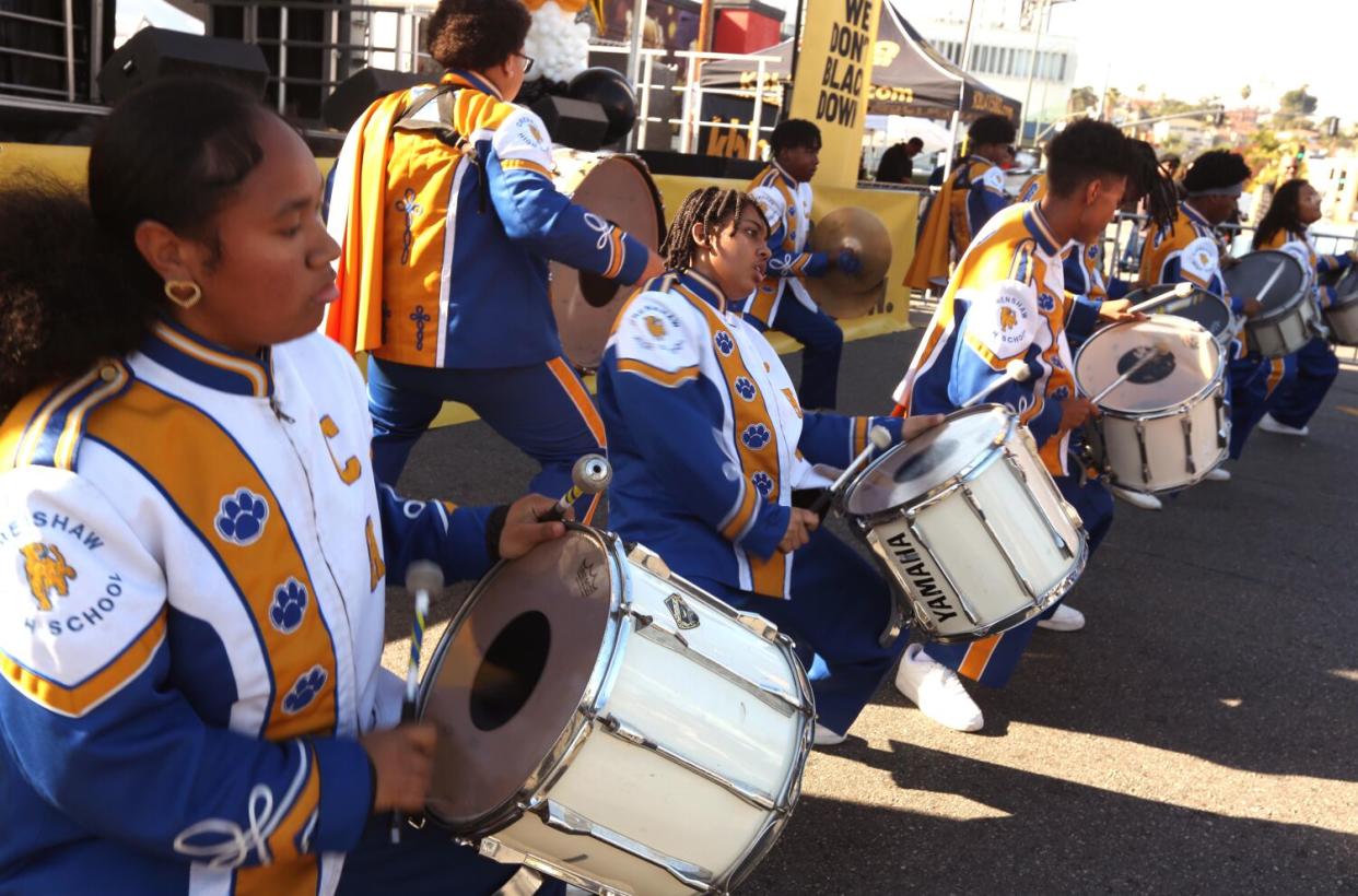 Members of the Crenshaw High School Marching Band perform at the KBLA 1580 Talk Radio "homecoming" event