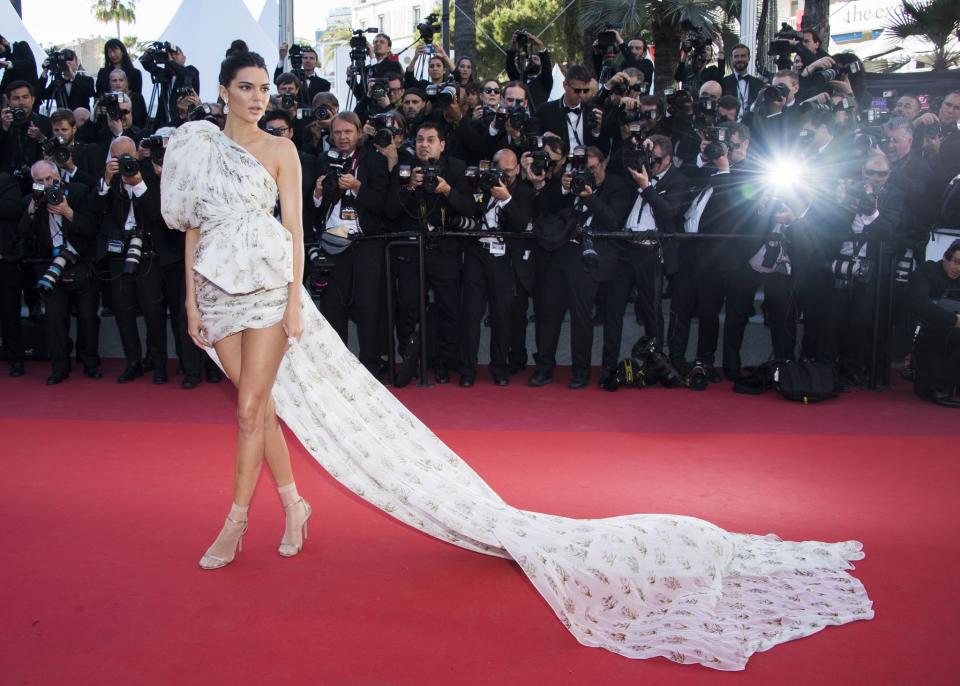 <p>Kendall Jenner turned heads in her distinct dress and accompanying train — to dramatic effect — from Giambattista Valli Couture at the <em>120 Beats Per Minute</em> premiere. (Photo: AP) </p>