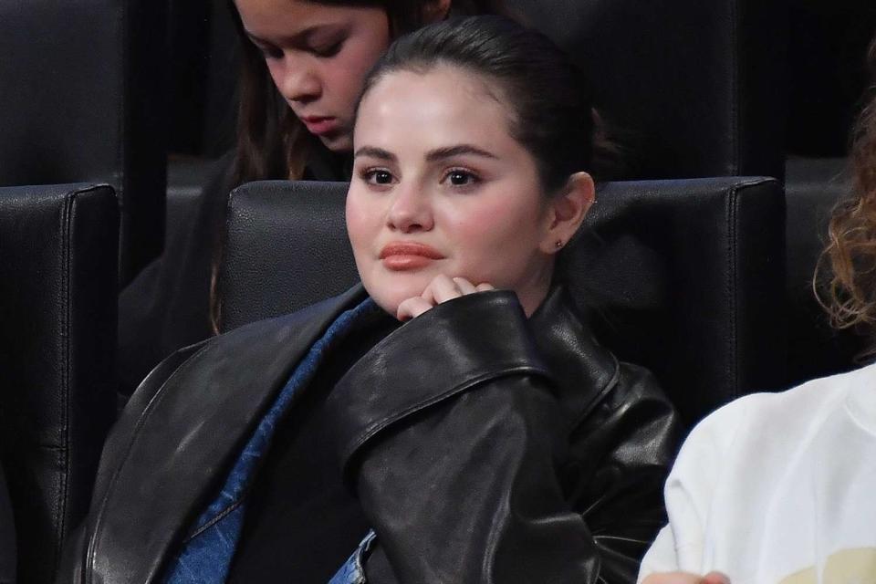 <p>Allen Berezovsky/Getty Images</p> Selena Gomez watches the Los Angeles Lakers on Oct. 30, 2023