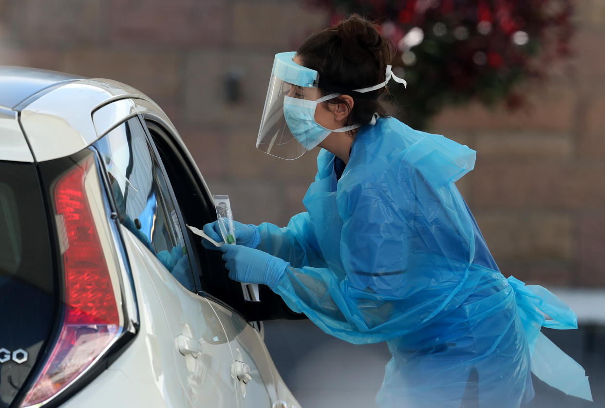 A nurse prepares to take a sample at a COVID 19 testing centre in the car park of the Bowhouse Community Centre in Grangemouth as the UK continues in lockdown to help curb the spread of the coronavirus.