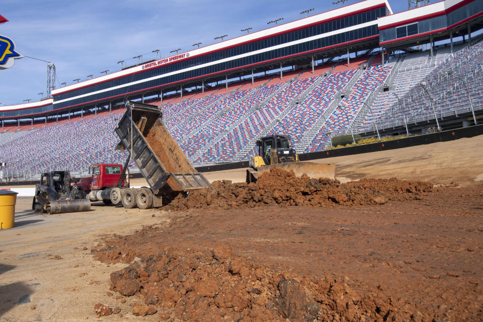 FILE - Workers turn Bristol Motor Speedway into a dirt track, in Bristol, Tenn., in this Thursday, Jan. 14, 2021, file photo. NASCAR wanted new energy and ideas this season and Marcus Smith has been pivotal in helping the sport deliver. The head of Speedway Motorsports dumped dirt all over Bristol Motor Speedway earlier this season and now guides NASCAR into a new market with this weekend’s triple header at Circuit of the Americas in Austin. (David Crigger/Bristol Herald Courier via AP, File)