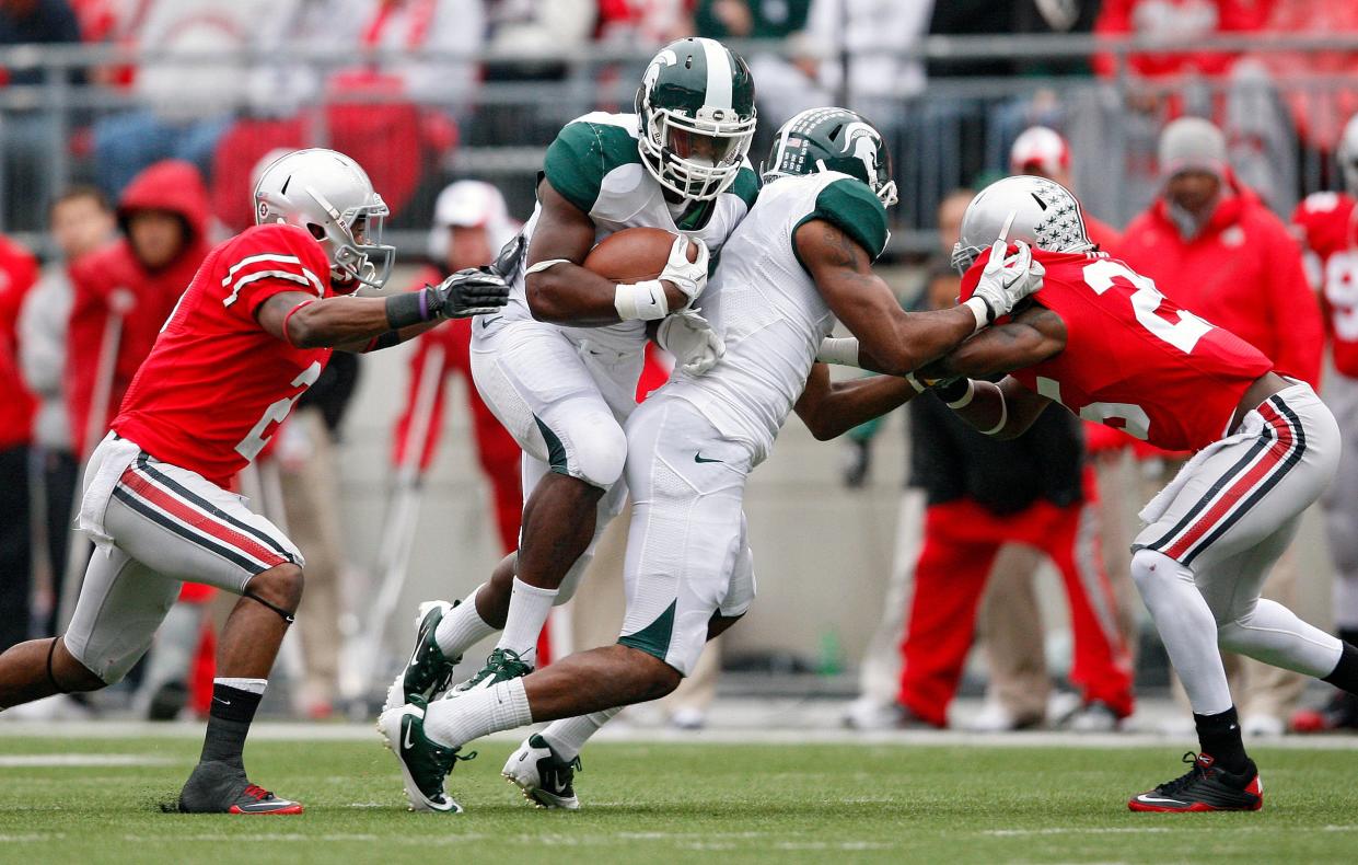 Michigan State's Le'Veon Bell, a Groveport graduate who was drafted by the Pittsburgh Steelers, carries the ball against Ohio State in 2011.