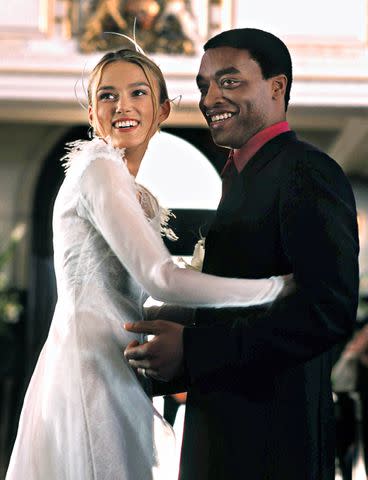 Everett Keira Knightley and Chiwetel Ejiofor in <em>Love Actually</em> (2003)