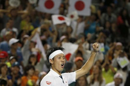 Japan's Kei Nishikori celebrates after winning his fourth round match against France's Jo-Wilfried Tsonga at the Australian Open tennis tournament at Melbourne Park, Australia, January 24, 2016. REUTERS/Issei Kato