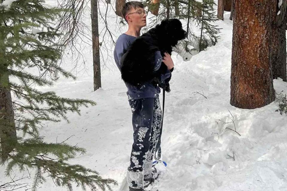 <p>Facebook/Summit Lost Pet Rescue</p> Pepper the dog with one of her rescuers in Blue River, Colorado