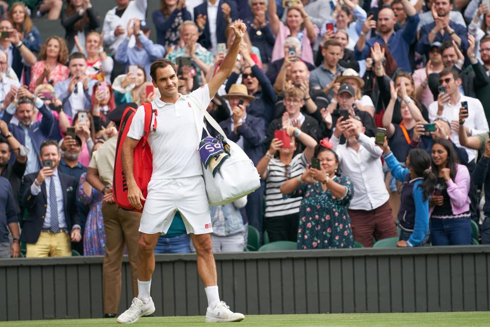 Roger Federer waving farewell to the Centre Court fans after losing to Hubert Hurkacz in the Wimbledon quarterfinals in 2021.