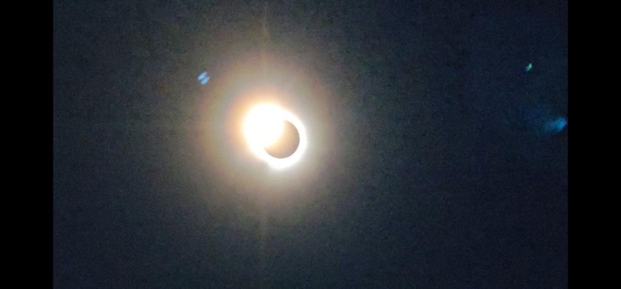 The "diamond ring" effect with a flash of sunlight the moment before the moon fully covers the sun during the April 8, 2024, total solar eclipse. As Joe Fluhr pointed out, we get to see these rare total solar eclipses because the moon is both 400 times closer than and 400 times smaller than the sun.