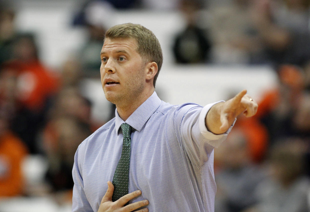 Le Moyne head coach Patrick Beilein signals to his players during the first half of an NCAA college basketball exhibition game against Syracuse, Wednesday, Oct. 31, 2018, in Syracuse, N.Y. (AP Photo/Nick Lisi)