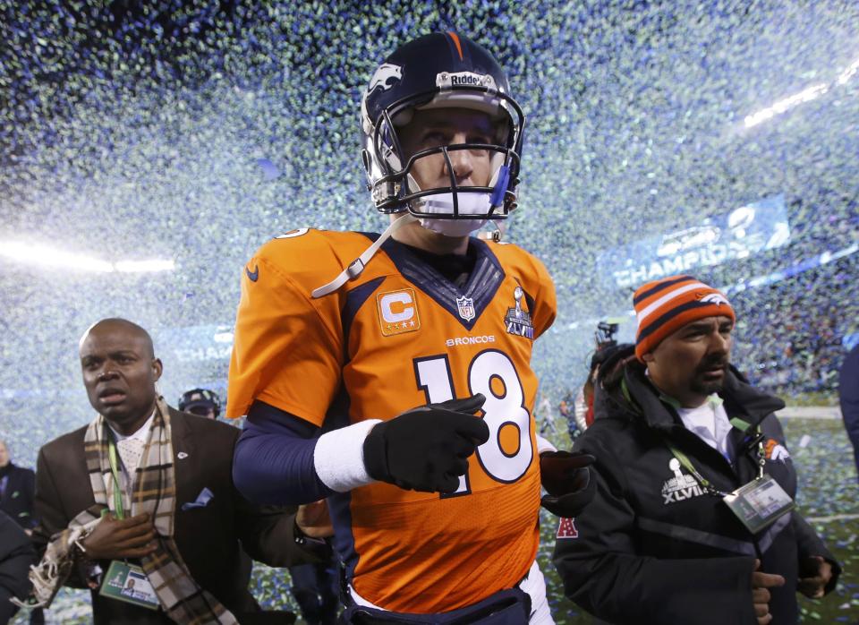 Denver Broncos quarterback Peyton Manning runs off the field after being defeated by the Seattle Seahawks in the NFL Super Bowl XLVIII football game in East Rutherford