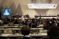 FILE - Kyoto Gov. Teiichi Aramaki makes a speech during the opening session of the U.N. Framework Convention on Climate Change, Dec. 1, 1997 in Kyoto, western Japan. (AP Photo/Katsumi Kasahara File)