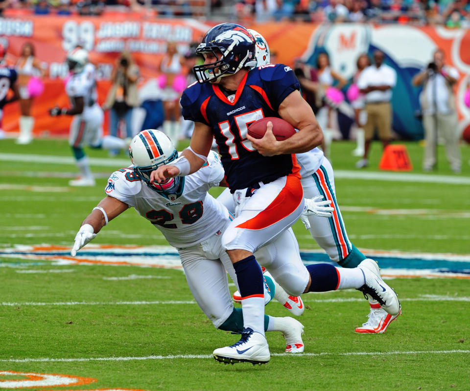 MIAMI GARDENS, FL - OCTOBER 23: Tim Tebow #15 of the Denver Broncos scrambles against the Miami Dolphins at Sun Life Stadium on October 23, 2011 in Miami Gardens, Florida. (Photo by Scott Cunningham/Getty Images)