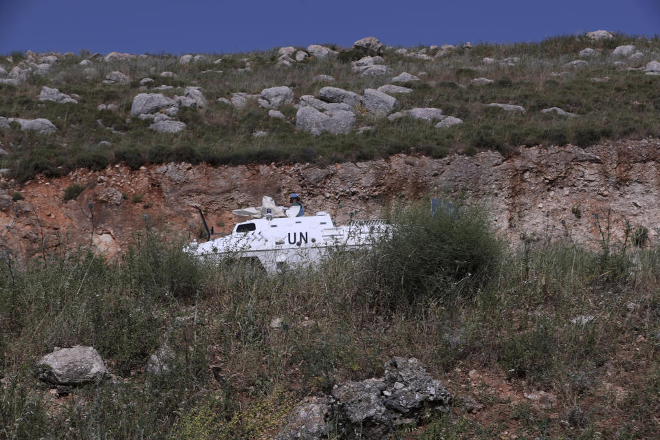 Spanish U.N peacekeepers patrol the Lebanese side of the Lebanese-Israeli border in the southern village of Kfar Kila, in the village of Kfar Kila, in southeast Lebanon, Wednesday, May 20, 2020. Twenty years after Hezbollah guerrillas pushed Israel's last troops from southern Lebanon, both sides are gearing up for a possible war that neither seems to want. (AP Photo/Bilal Hussein)