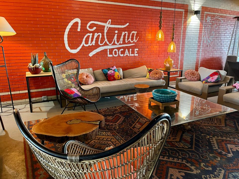 Cantina Locale's outdoor area offers standard dining tables as well as a cozy lounge.