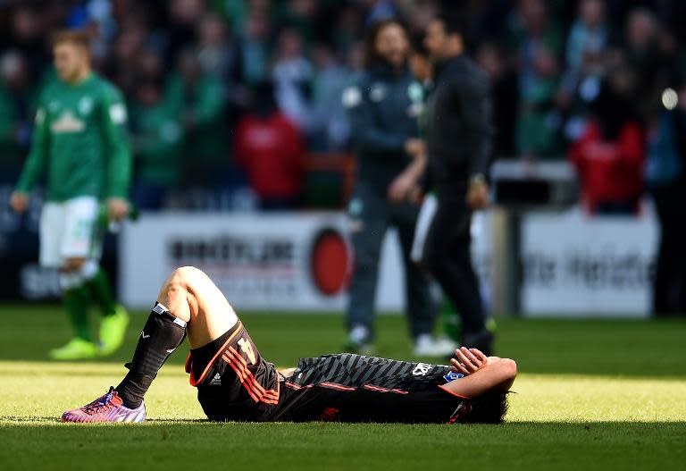 Hamburg's defender Heiko Westermann reacts after the German first division Bundesliga football match against Werder Bremen on April 19, 2015