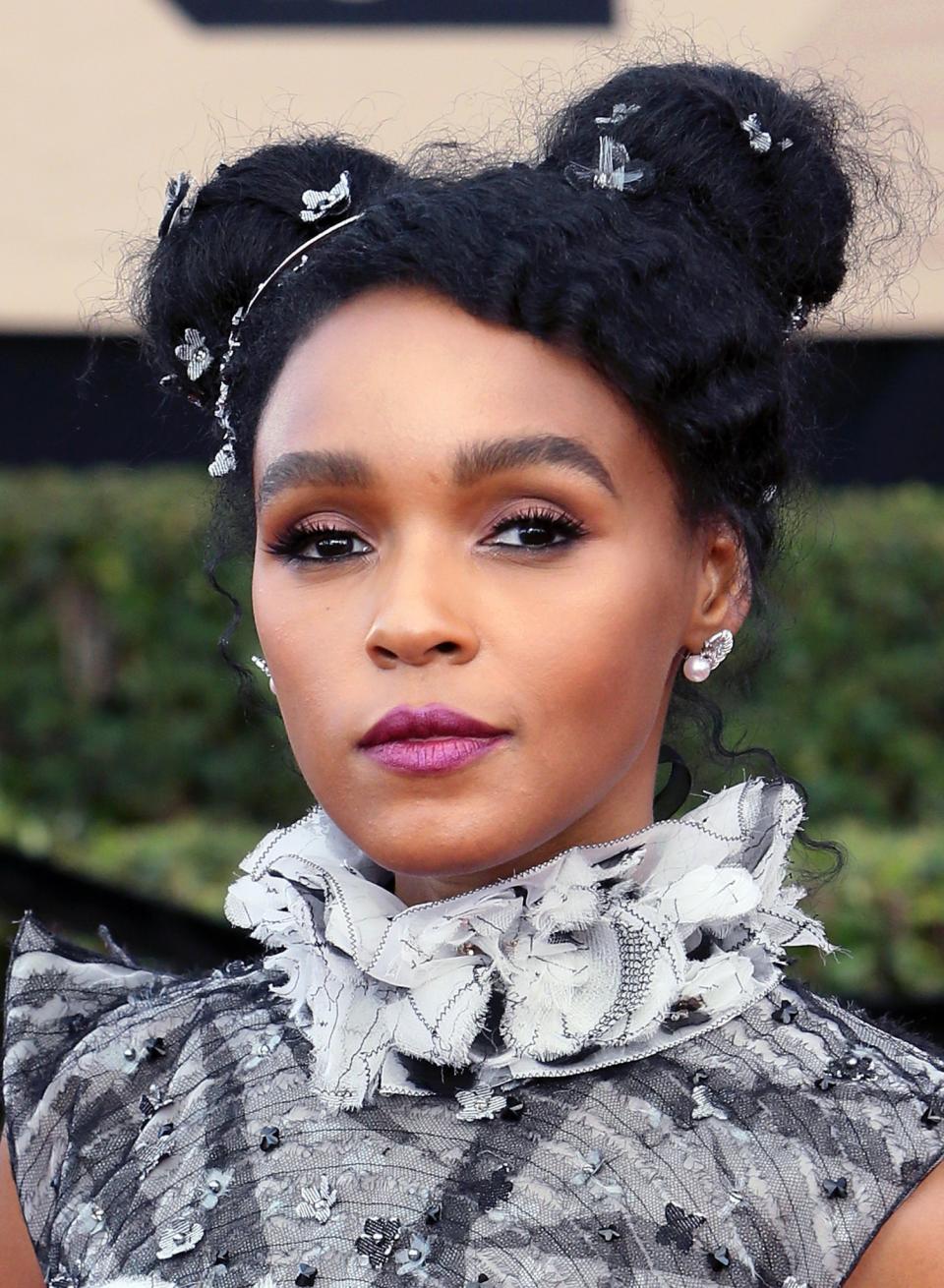 <p>Monoe’s hair was ON-POINT! The actress looked stunning with her embellished buns and a bold purple lip. [Photo: Getty] </p>