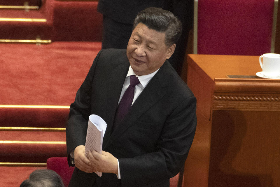 Chinese President Xi Jinping leaves after the opening session of the Chinese People's Political Consultative Conference in Beijing's Great Hall of the People, Sunday, March 3, 2019. (AP Photo/Ng Han Guan)