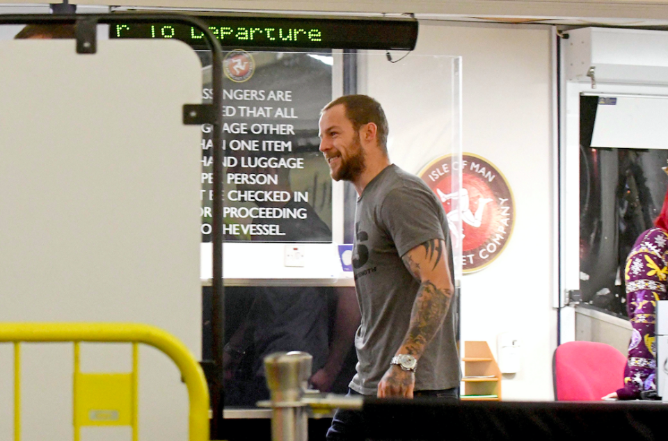 Dale McLaughlan boarding a ferry back home after he rode a jet ski across the Irish Sea to see his girlfriend. (SWNS)