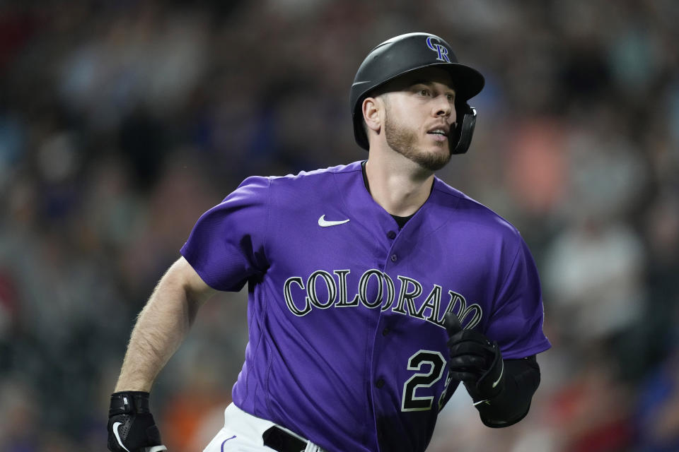 Colorado Rockies' C.J. Cron heads up the first-base line after hitting a three-run home run off Texas Rangers relief pitcher Brock Burke in the seventh inning of a baseball game Tuesday, Aug. 23, 2022, in Denver. (AP Photo/David Zalubowski)