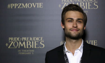 Cast member Douglas Booth poses at the premiere of "Pride and Prejudice and Zombies" in Los Angeles, California January 21, 2016. REUTERS/Mario Anzuoni