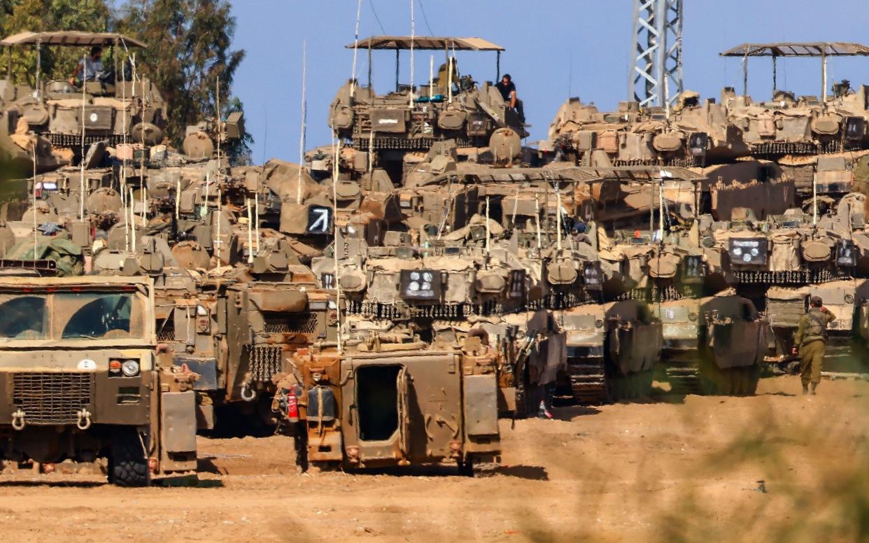 Israeli tanks gather on Thursday at an undisclosed location near the border with Gaza