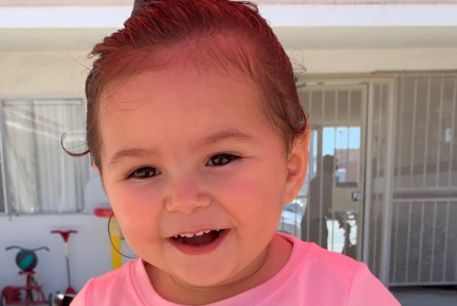 A photo of two-year-old June Love Agosto – who died in her mum's hot car in Torrance, California – wearing a pink T-shirt. 