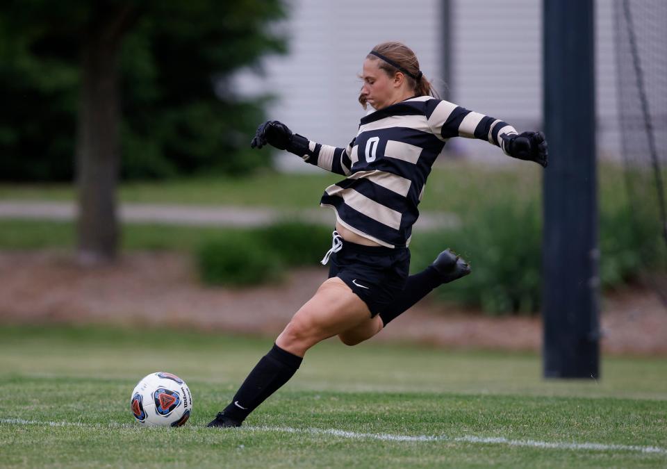 Williamston goalkeeper Abby Pieper clears the ball against Flint Powers Catholic, Saturday, June 11, 2022, in Williamston. Williamston won 4-0.