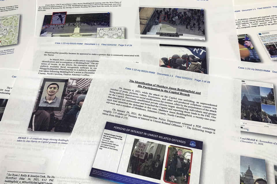 FILE - The Statement of Facts supporting the arrest warrant for Matthew Jason Beddingfield on charges stemming from the Jan. 6, 2021, riot at the U.S. Capitol, is photographed on Feb. 8, 2022. Beddingfield who stormed the U.S. Capitol while awaiting trial for a shooting in North Carolina has been sentenced to more than three years in prison for attacking police with a flagpole during the riot. (AP Photo/Jon Elswick, File)