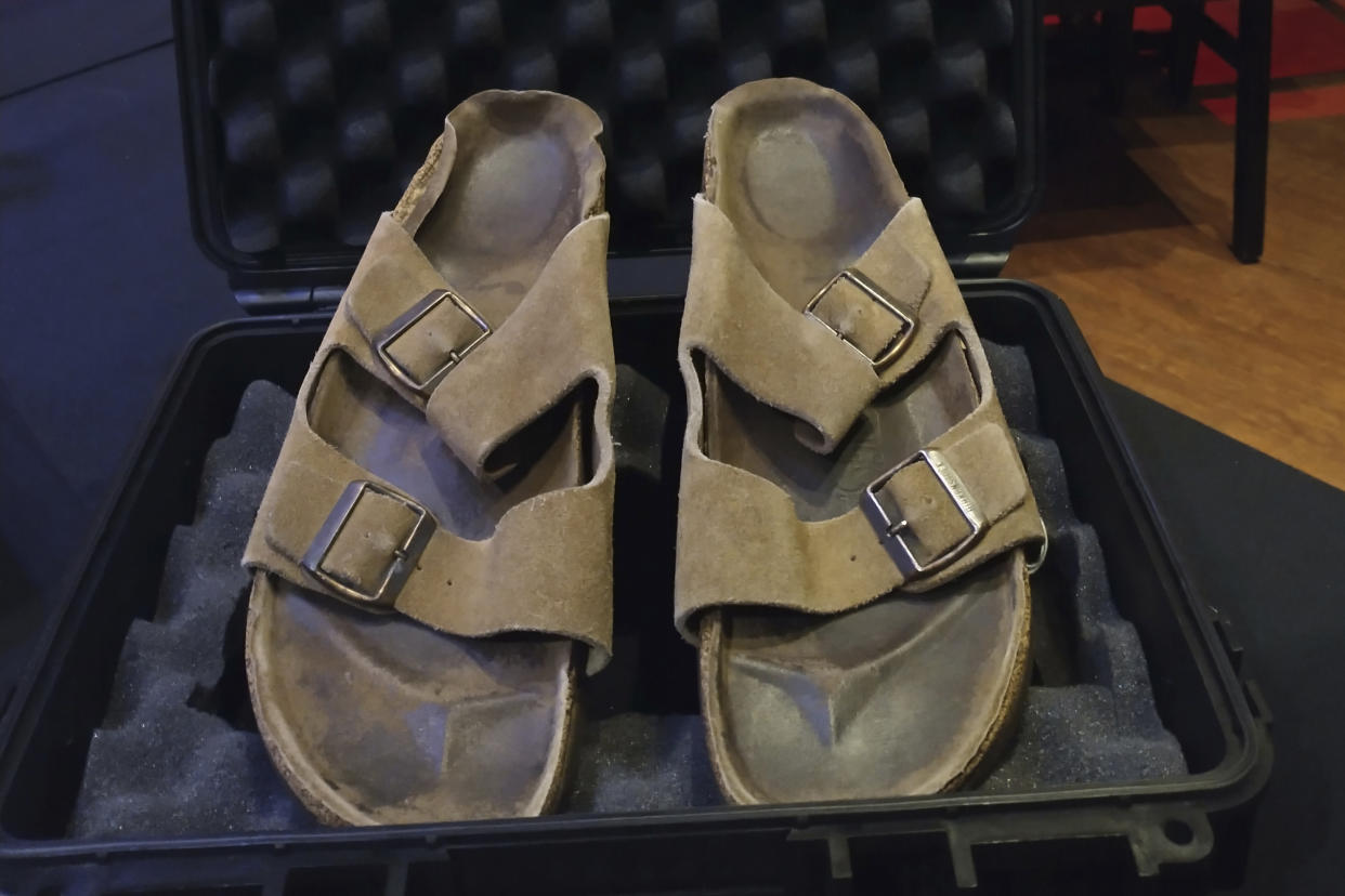 In this photo provided by Julien's Auctions are Steve Jobs' Birkenstock sandals sold at their Idols & Icons Rock N' Roll auction at the Hard Rock Cafe in New York, Sunday Nov. 13, 2022. The California house where Steve Jobs co-founded Apple is a historical site, and now the sandals he wore while pacing its floors have been sold for nearly $220,000, according to an auction house. The "well used" brown suede Birkenstocks dating to the mid 1970s set a record for the highest price ever paid for a pair of sandals, according to Julien's Auctions. (Julien's Auctions via AP)