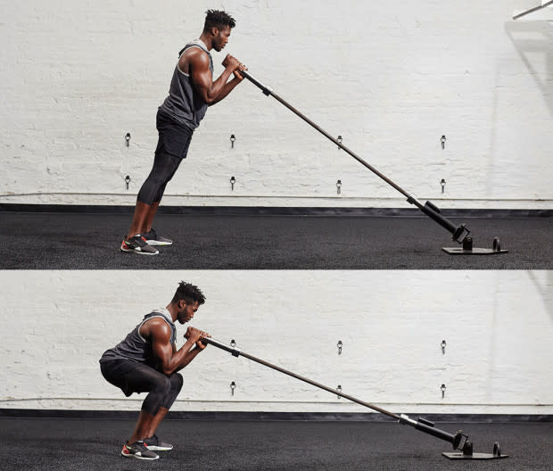 How to do it:<ol><li>Stand facing landmine, holding barbell fist-over-fist so thumbs are on top. Step back so body leans forward, placing some bodyweight into barbell, to start. </li><li>Drop down into a squat so barbell is just under chin, then reverse. That's one rep. </li></ol>