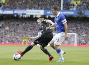 Everton's Seamus Coleman (right) and Chelsea's Andre Schurrle (left) battle for the ball 