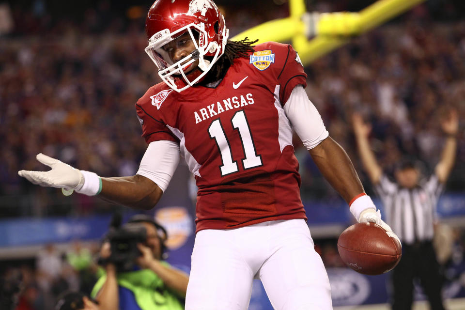 Jan 06, 2012; Arlington, TX, USA; Arkansas Razorbacks wide receiver Cobi Hamilton (11) celebrates after catching a touchdown pass during the second half against the Kansas State Wildcats in the 2012 Cotton Bowl at Cowboys Stadium. Mandatory Credit: Kevin Jairaj-USA TODAY Sports