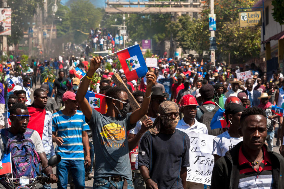 Haitians demonstrate during a protest to denounce the draft constitutional referendum carried by the President Jovenel Moise on March 28, 2021 in Port-au-Prince, Haiti.<span class="copyright">Sabin Johnson —Anadolu Agency/Getty Images</span>