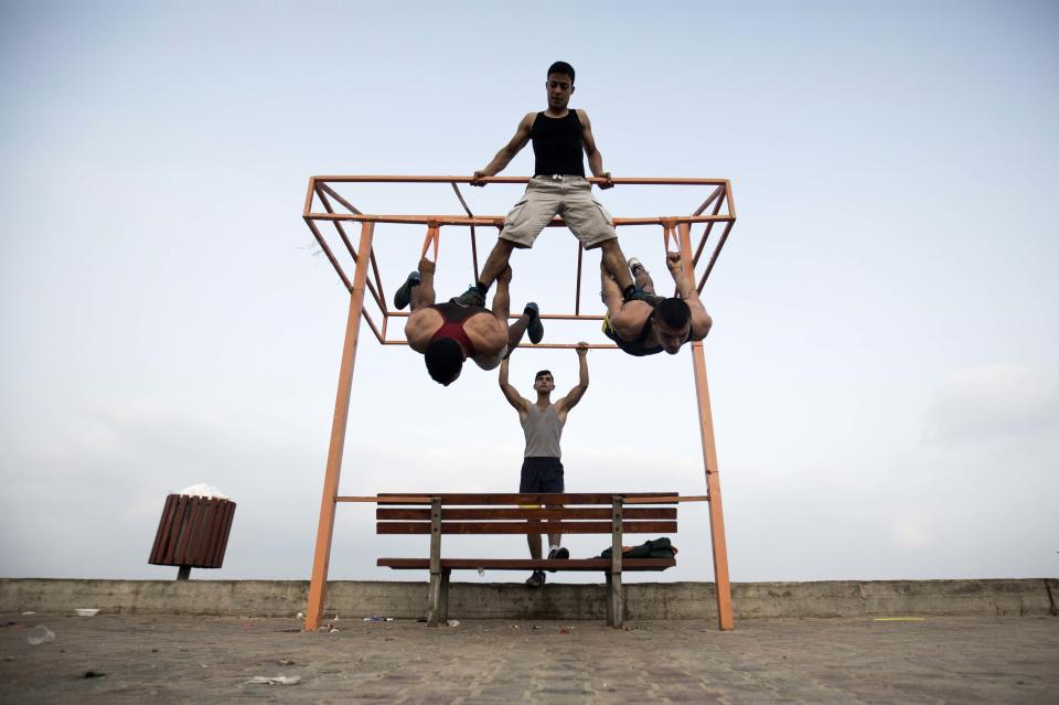 Palestinian group, Bar Palestine, take part in street exercises on the coast of Gaza City on August 3, 2015. Street workout, that is still new to Gaza, is a growing sport across the world with annual competitions and events.