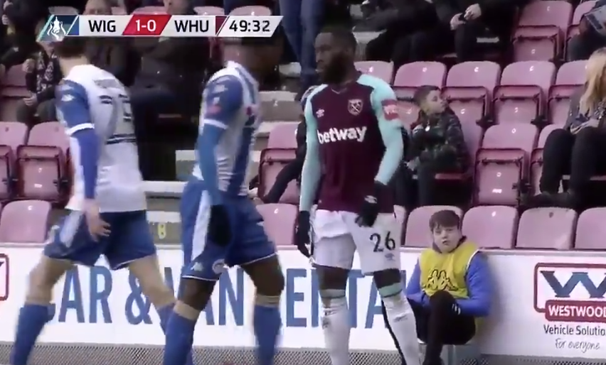 Arthur Masuaku spits at Nick Powell during West Ham’s 2-0 FA Cup loss to Wigan. (Screenshot: Twitter)