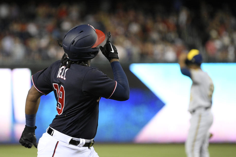 Washington Nationals' Josh Bell (19) celebrates his three-run home run during the sixth inning of the team's baseball game against the Milwaukee Brewers, Friday, June 10, 2022, in Washington. (AP Photo/Nick Wass)