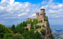 <p>If you’re visiting the world’s oldest, smallest republic, you’ll find it entirely engulfed in Italy. The Republic of San Marino is an enclave, as is Vatican City. After crossing the quirky border, you can score one of <a rel="nofollow noopener" href="http://www.travelandleisure.com/travel-tips/offbeat/coolest-passport-stamps/7" target="_blank" data-ylk="slk:the world’s coolest passport stamps;elm:context_link;itc:0;sec:content-canvas" class="link ">the world’s coolest passport stamps</a>.</p>