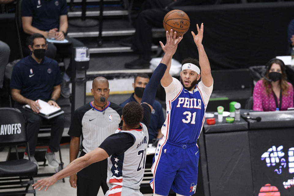 Philadelphia 76ers guard Seth Curry (31) shoots against Washington Wizards center Daniel Gafford (21) during the second half of Game 4 in a first-round NBA basketball playoff series, Monday, May 31, 2021, in Washington. (AP Photo/Nick Wass)