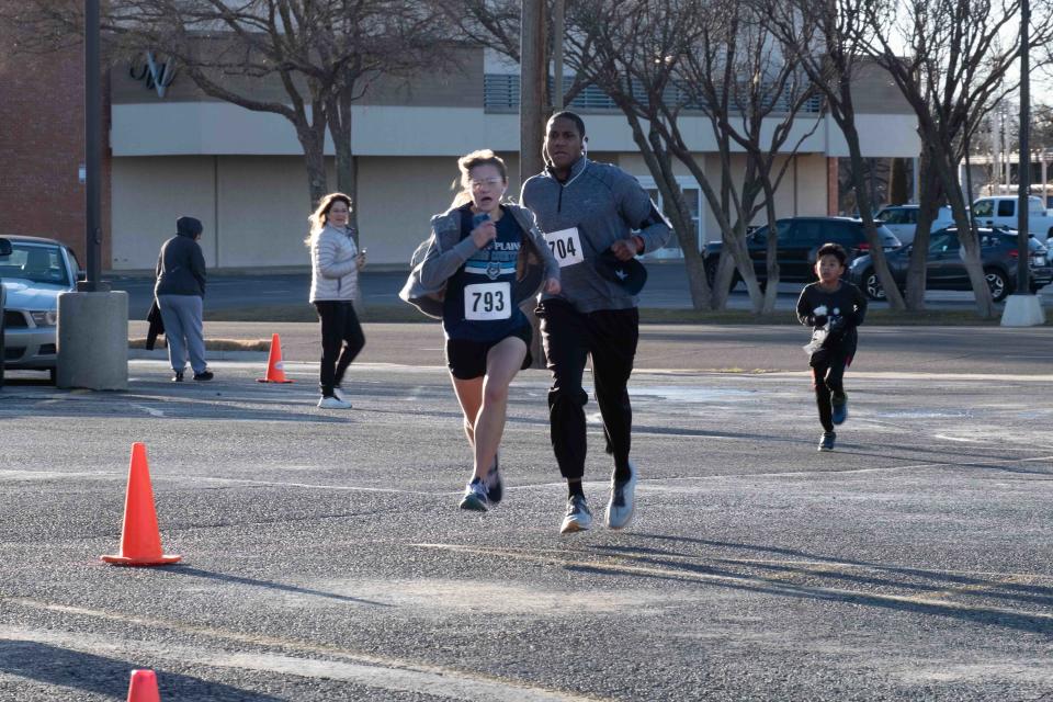 Assistant principal of Eastridge Elementary Patrick Miller tries to finish strong Saturday at the Cold As Ice run in Amarillo.