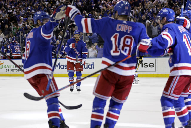 New York Rangers defenseman K'Andre Miller (79) reacts toward teammates after scoring a goal against the Pittsburgh Penguins during the second period in Game 7 of an NHL hockey Stanley Cup first-round playoff series Sunday, May 15, 2022, in New York. (AP Photo/Adam Hunger)
