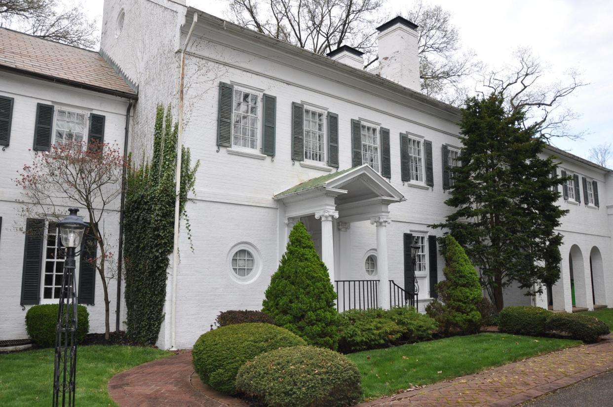 Built in 1940 by the late William H. Morgan Jr., this five-bedroom early colonial mansion on Glamorgan Street in Alliance will be auctioned at noon Wednesday. He lived there until his death in 1982. Current owner Carol Fleisher is downsizing.