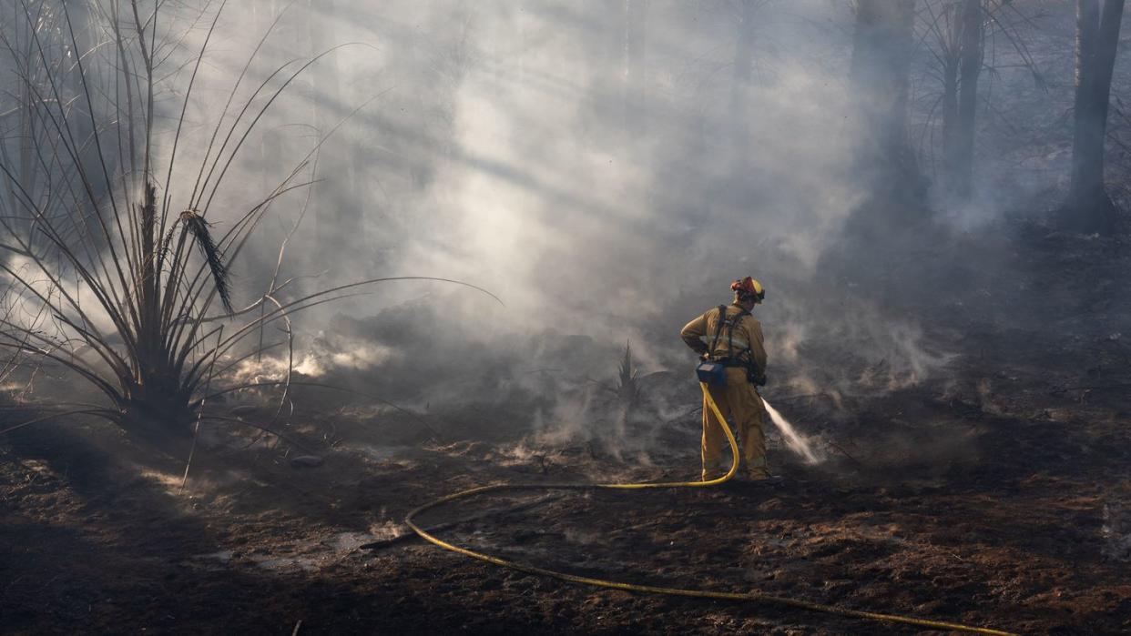 jurupa valley ca june 17 a firefighter battles a brush fire that broke out friday afternoon on june 17 2022 in jurupa valley, california